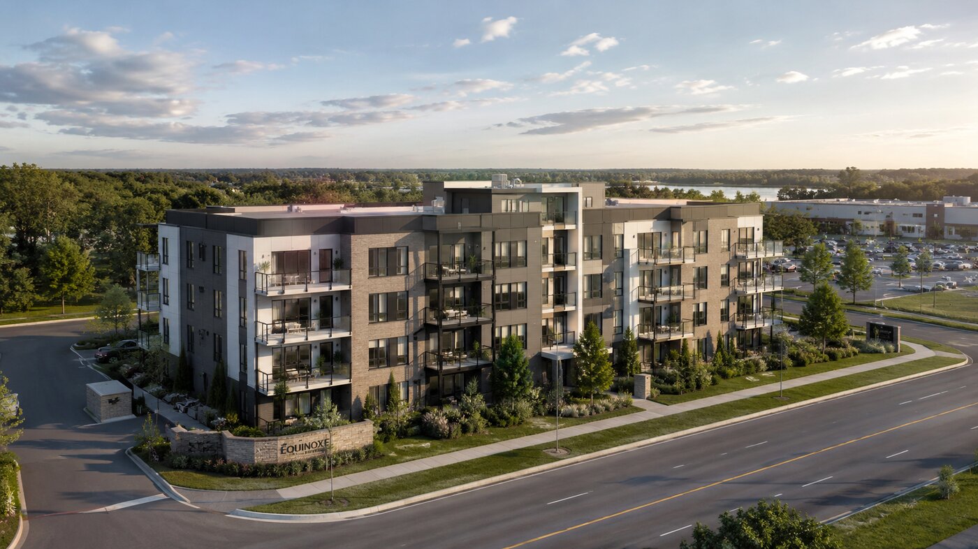 Aerial view of Enoa Saint-Constant 2, a modern residential building surrounded by greenery with river views